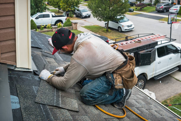 Professional Roofing technician working in Bryant, IN